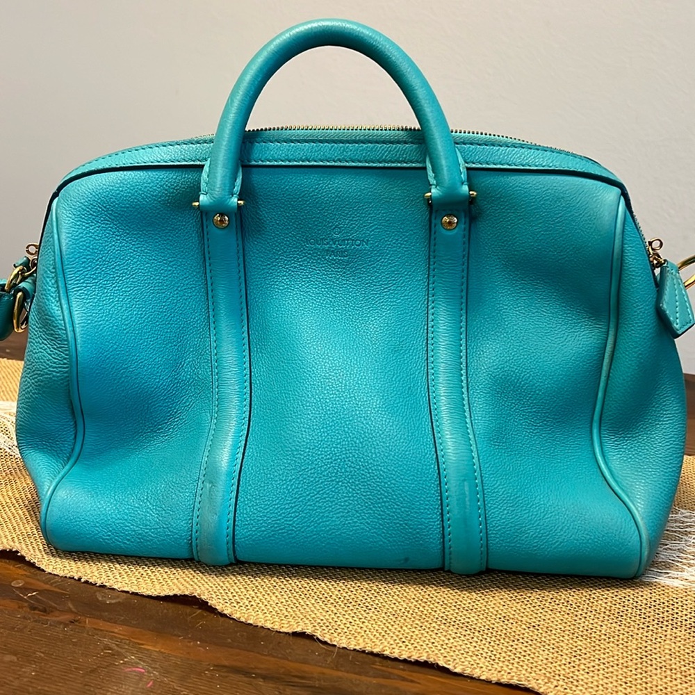 Turquoise Sophia Coppola and Louis Vuitton handbag